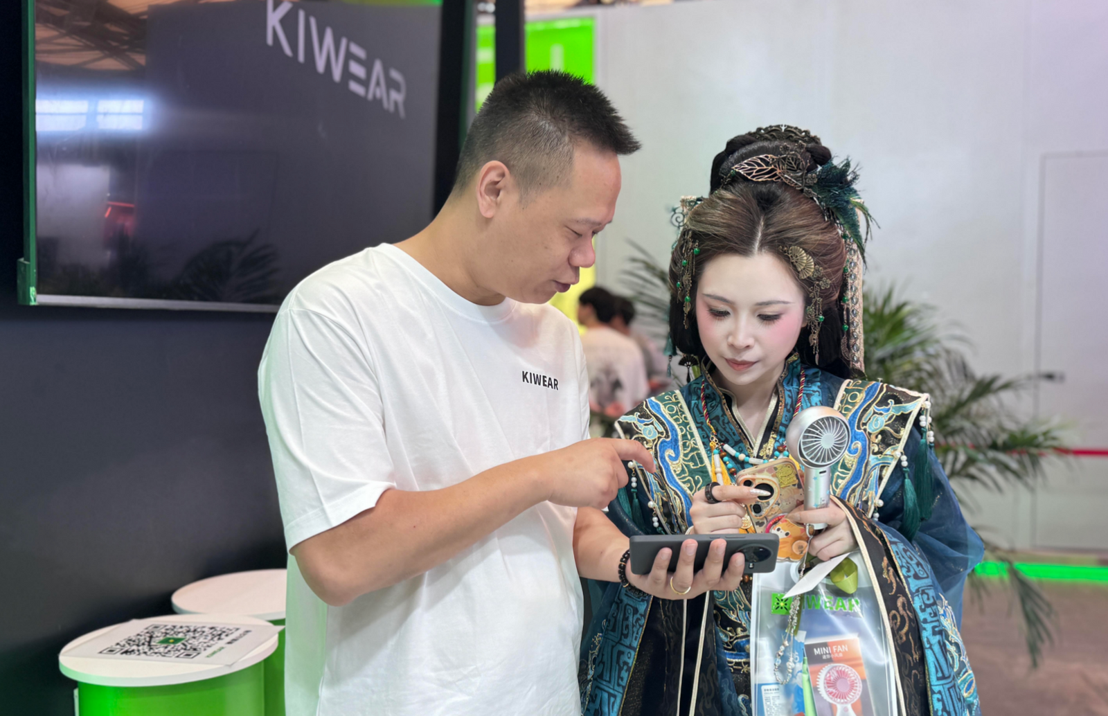 Attendees at the KiWear booth