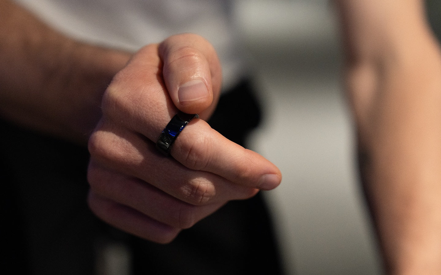 A hand wearing the KiWear Ring